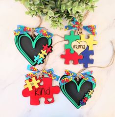 four pieces of puzzle heart shaped ornament with the word mama on them