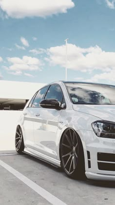 a white car parked in a parking lot