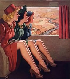 three women sitting on a train looking out the window