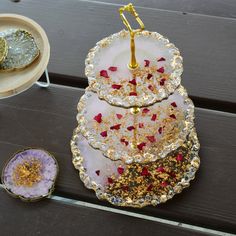 These beautiful 3 tier cake stands are made on custom order. The size of plates are 10 inches, 8 inches and 6 inches respectively. These are completely made with resin  Embellished with rose petals and crystals  the hardware is metal and its sturdy unlike aluminum hardware. Check out https://www.etsy.com/shop/TheRUHART for more products and designs Resin Cake Stand, Resin Art Canvas, Birthday Decorations At Home, 3 Tier Cake Stand, 3 Tier Cake, Resin Crafts Tutorial, Tier Cake, Diy Resin Art, Wedding Function