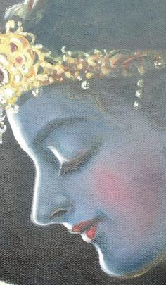 an oil painting of a buddha face with gold and jewels on it's head