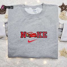 The Lightning McQueen x Nike Cartoon Embroidered Sweatshirt is a must-have for any Disney and Cars fan! This unique sweatshirt Nike Cartoon, Disney Car, Beloved Movie, Unique Sweatshirt, Custom Nike, Car Shirts, The Lightning, Disney Character, Disney Shirt