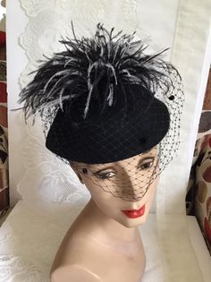 "Vintage 1970's dark Black Wool Felt hat. Has veiling with Black and White feathers. Label is *Miss Bierner*. Made in USA. *MORE INFORMATION BELOW* CONDITION: No issues noted. MEASURES: Inside circumference~21\" Front to back~7\" Left to right~8\" *WE APOLOGIZE~BUT WE NO LONGER SHIP TO GERMANY, ITALY OR SPAIN. IF ORDERS COME IN FROM GERMANY, ITALY OR SPAIN, WE WILL HAVE TO CANCEL THEM AND REFUND YOUR MONEY. SORRY FOR THIS INCONVENIENCE*" Black Brimmed Fall Costume Hat, Black Brimmed Costume Hat For Fall, Brimmed Black Costume Hat For Fall, Black Cloche Hat For Church, Black Cloche Church Hat, Black Brimmed Mini Hat For Fall, Black Mini Hat With Short Brim For Fall, Vintage Wide Brim Mini Hat For Fall, Black Cloche Costume Hat For Church