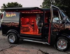 a black van with an orange and red interior