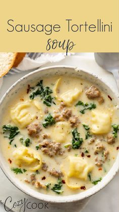 sausage tortellini soup in a white bowl with bread on the side