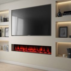 a large television mounted on the wall above a fire place