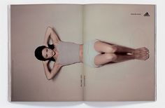 an open book with a woman's body and legs