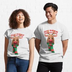 two people wearing t - shirts with reindeers on them