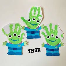 three green hand prints with the words ynsk on them