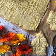 some cookies and flowers on a table