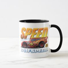 a white and black coffee mug with the words speed in front of an image of a car