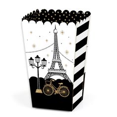 a black and white striped box with a bike in front of the eiffel tower