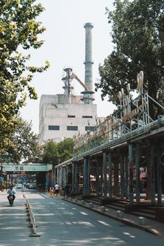 an empty street in front of a factory