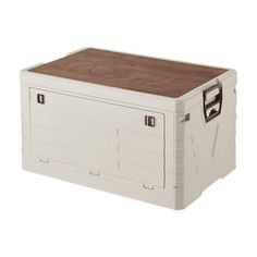 a large white cooler with wooden lid and handles on the top, sitting against a white background