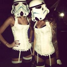 two women dressed up as stormtroopers and one is wearing a corset