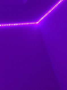 a purple wall with some lights on it