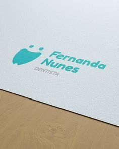 the logo for fernanda nunes is displayed on a piece of paper that has been folded over