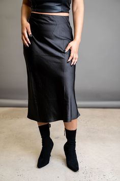 A slip skirt is a wardrobe must-have. This classic is the perfect wardrobe essential that can go from day to night depending on your vibe. Wear it with heels for the perfect date night look, or wear it with sneakers to transition it to the perfect errand skirt. FEATURES Zipper side closure Elastic waist Light stretch SIZE & FIT Model is wearing a size: Small. True to size. DETAILS 100% Polyester CARE Hand wash cold. Do not bleach. Line dry. Iron low. Fall Night Out Midi Pencil Skirt, Sleek Party Midi Skirt, Chic Flared Skirt For Date Night, Spring Evening Midi Length Pencil Skirt, Chic Evening Pencil Skirt For Fall, Chic Fall Evening Pencil Skirt, Sleek Midi Skirt, Sleek Knee-length Lined Skirt, Chic Midi-length Skirt For Date Night