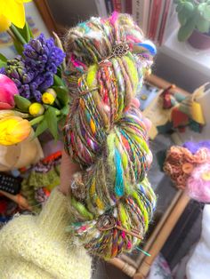 the yarn is multicolored and ready to be picked up from the store for sale