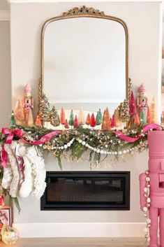 a fireplace decorated for christmas with pink decorations