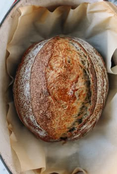 a loaf of bread sitting inside of a pan