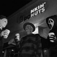 three people dressed up in halloween costumes holding cups and talking to each other while wearing masks