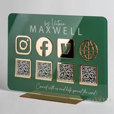 a green and gold business card with qr code on it