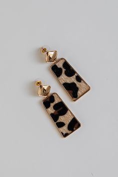 Everyone will admire your impeccable style when you wear the Serena Leopard Drop Earrings! These trendy earrings start with a stud post back and have a drop design with leopard detailing. Add these fun earrings to a black dress + heels to add a chic touch to your date night look! Gold Plated Leopard Print Drop Shape Stud Post Back One Size | Length 2” Black Dress Heels, Black Dress With Heels, Sneaker Heels Wedges, Fall Flannel, Cute Leopard, Casual Bodysuit, Dress Heels, Drop Design, Rust Dress