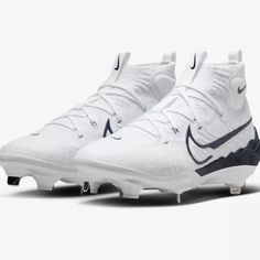 a pair of white and blue nike cleats