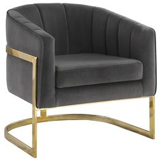 a grey velvet chair with gold legs