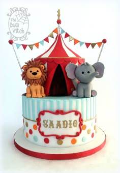 there is a circus cake with animals on it