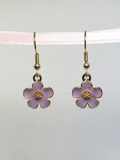 These small, cute flower charms measure approx. .5" round. Total drop length is approx. 1.75" I will ship USPS First Class mail please keep in mind this ALWAYS includes a TRACKING number. You will be notified via Etsy with tracking information. A satisfied customer is my goal and a five-star review is appreciated, if you have any problems or issues with your purchase or you are not 100% Happy, please contact me. Keep in mind I do not accept returns at this time, but I am willing to work with you to solve any issues that may occur with a purchase. THANKS FOR STOPPING BY! Pink Metal Drop Flower Earrings, Pink Flower Metal Earrings, Pink Flower-shaped Metal Earrings, Trendy Metal Flower Earrings, Trendy Metal Flower Shaped Earrings, Trendy Metal Flower-shaped Earrings, Metal Flower Charm Earrings For Spring, Metal Flower Charm Earrings, Trendy Purple Flower Earrings For Gift