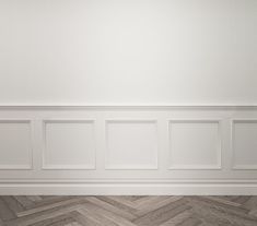 an empty room with white walls and herringbone flooring on the wall is shown