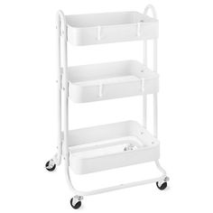 a white cart with three trays on it