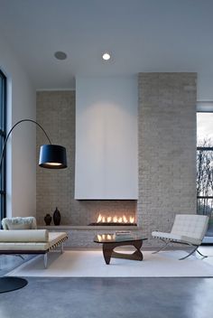 modern living room with fireplace and white furniture