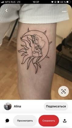 the sun and moon line work tattoo is on someone's leg, it looks like they