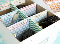 an open box filled with lots of different types of paper cups and napkins on top of a table