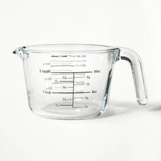 a glass measuring cup on a white surface