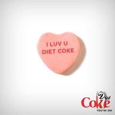 a heart shaped candy with the words i luv u diet coke on it