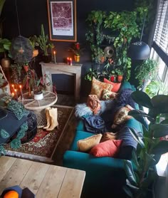 a living room filled with furniture and lots of plants