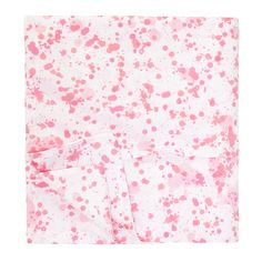 a pink and white blanket with spots on it