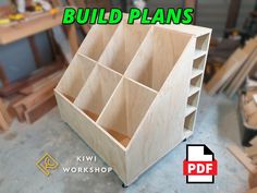 a wooden box with multiple compartments in it and the words build plans above it that says kiwi workshop