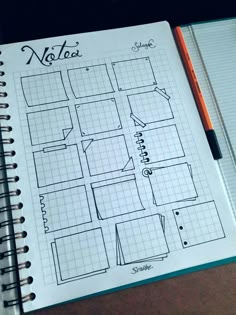 a notebook with a grid paper on top of it