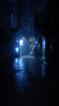 a dark alley way at night with the lights on