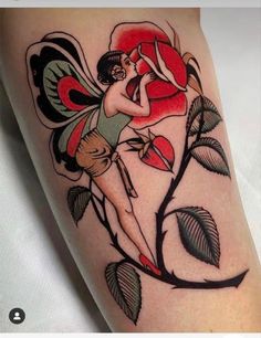 a woman with a flower tattoo on her arm and leg is holding a red rose