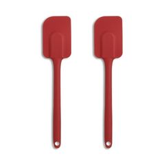 two red spatulas sitting next to each other