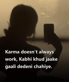 a person holding a cell phone in their hand and texting on the screen that reads karma doesn't always work, kashi khud jake gaali deden chahye