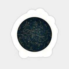 a black and gold plate with stars in the sky on it's side, against a white background