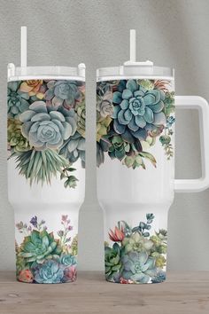 two coffee mugs with succulent designs on them