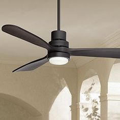 a black ceiling fan in a room